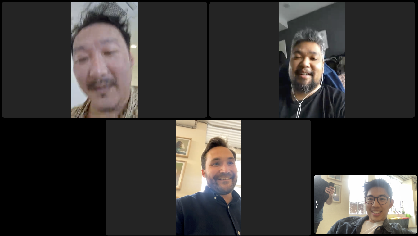 A virtual meeting screenshot featuring five participants, with some appearing through video calls and others in square black frames